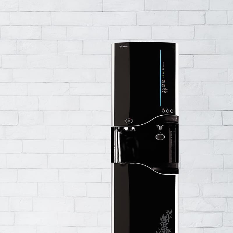 Bottleless water Cooler against brick background