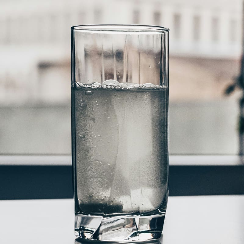 glass of water near office window